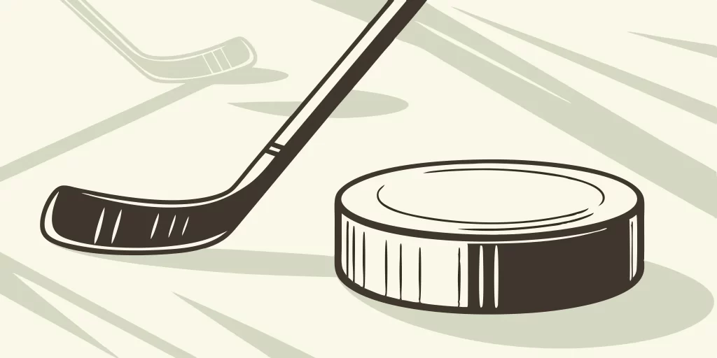 Men's league hockey puck and stick.