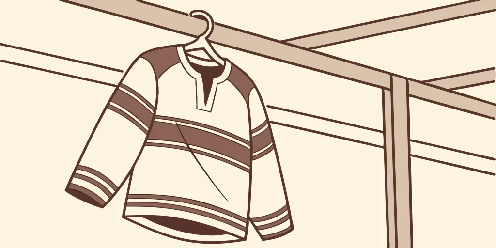 Los Angeles Kings retro jersey on hanger.