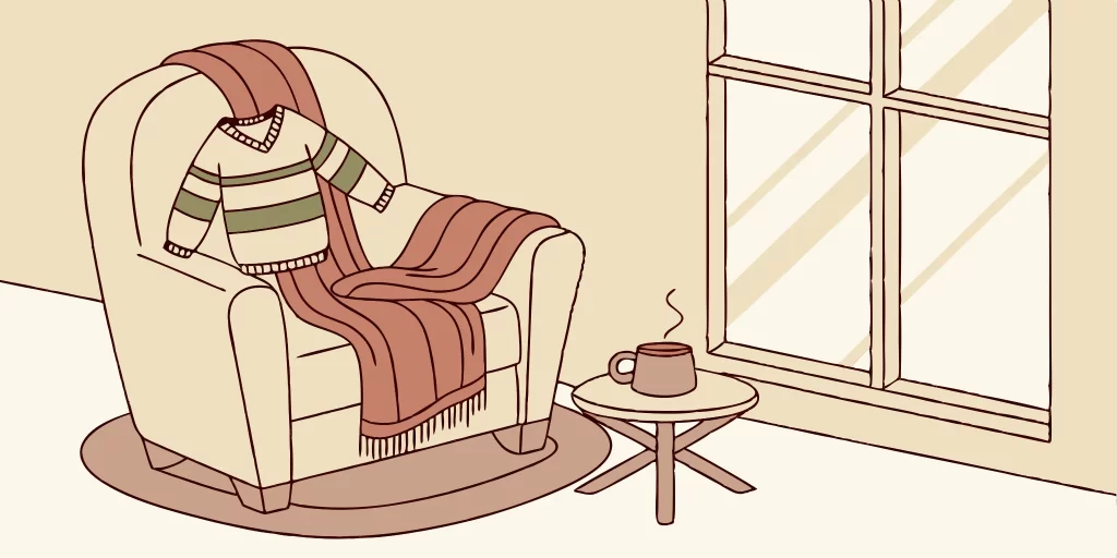 Striped sweater draped over chair. Perfect sweater size guide.