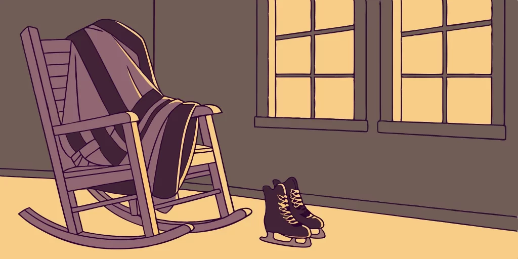 LA Kings purple and black jersey draped over chair.